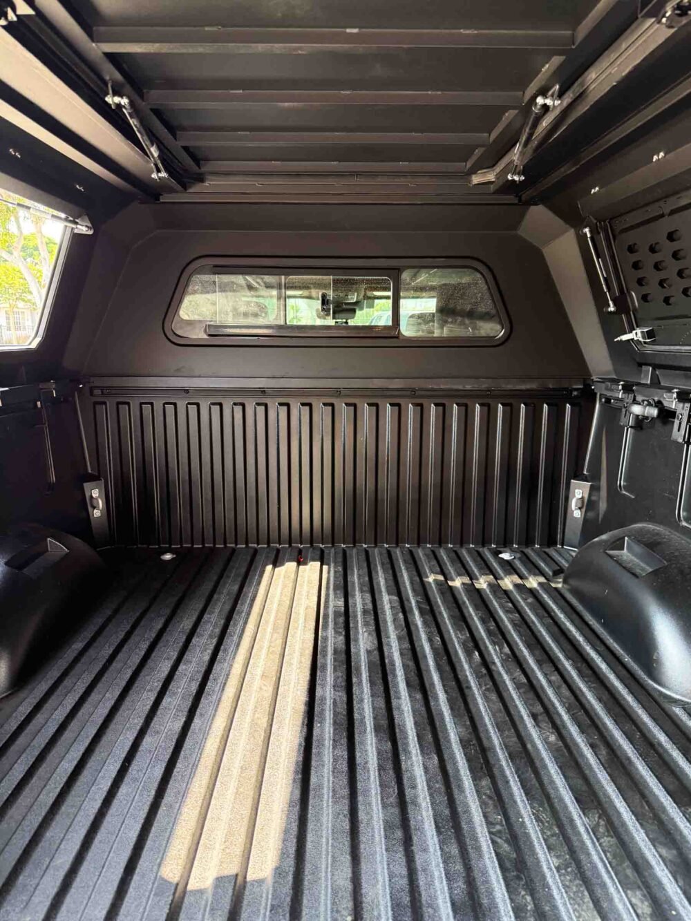 Tundra 5.5ft Camper Shell - Inside View - Front Sliding Window
